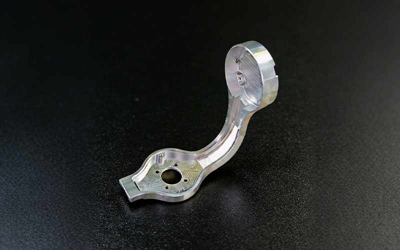 CNC machined aluminum 7075 gimbal arm for drone camera stabilizer with lightweight pocketing.