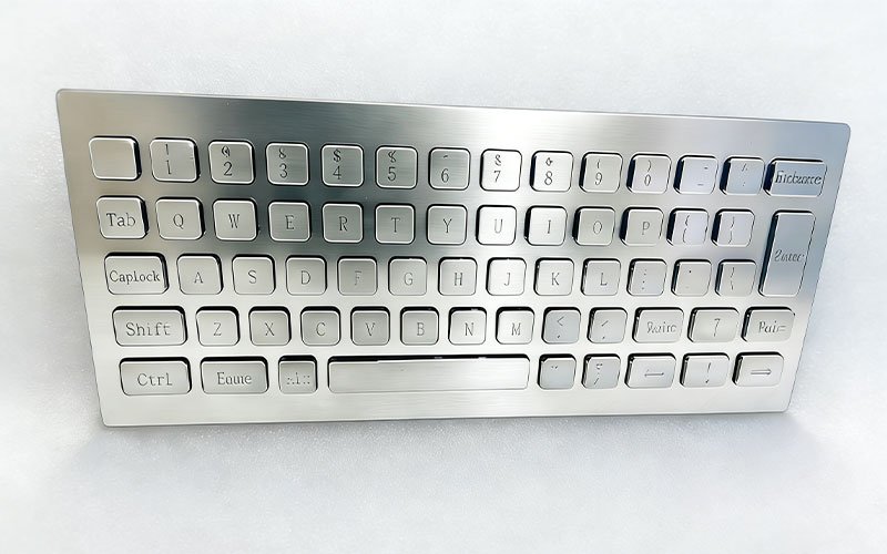 Front view of Custom Stainless Steel CNC Keyboard machined from 316L material for marine control systems,