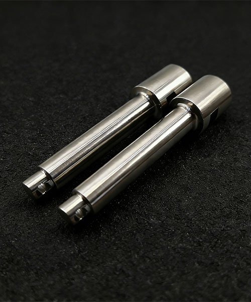 Titanium-Grade-5-CNC-Machining-Parts Close-up of CNC turned Titanium Grade 5 (Ti-6Al-4V) components showing high-precision surface finish and complex groove details.