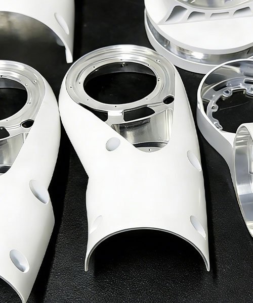 CNC machined aluminum robotic arm link with skeletonized design for weight reduction and high stiffness.