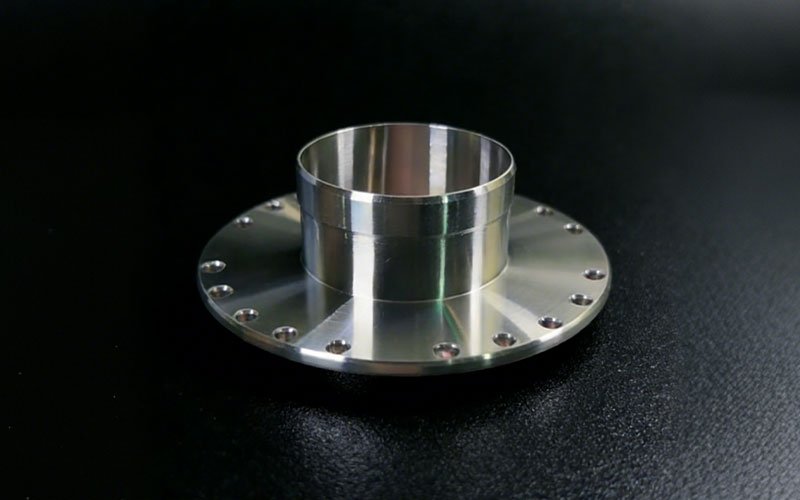 CNC turned thin-wall steel cup for harmonic drive flexspline, shown before gear cutting.