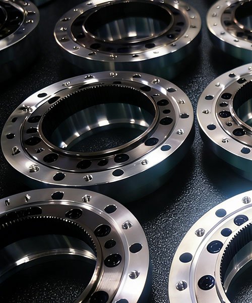 Batch production of CNC machined circular splines (rigid splines) for harmonic reducers.