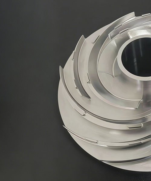 Close-up of a custom 5-axis CNC machined metal impeller featuring thin curved blades and complex geometry, demonstrating high-precision simultaneous milling capabilities.