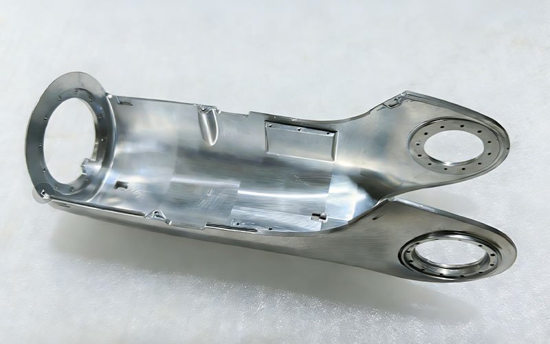Custom 5-axis CNC machined aluminum arm shell for humanoid robot, featuring complex curved surfaces and thin-wall structure.
