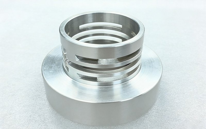 Custom CNC machined stainless steel alloy coupling with helical beam design for automation.