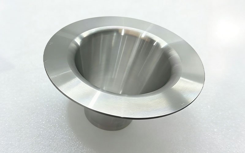 Bottom view of a precision CNC turned precision thin-wall conical aluminum component with thin-wall conical structure.