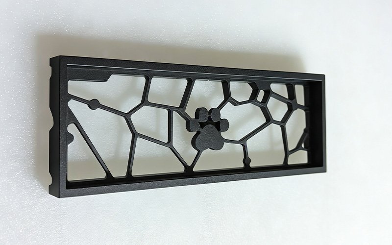 Custom CNC machined aluminum keyboard frame with cat paw design, made from Aluminum 6061 with black anodized finish.