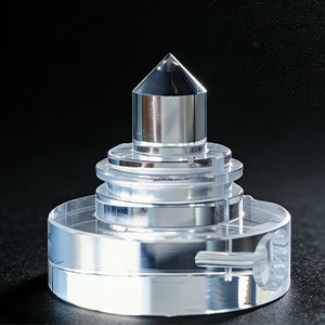 As-Machined Optical Component CNC machined acrylic component with optical clarity and stepped geometry.