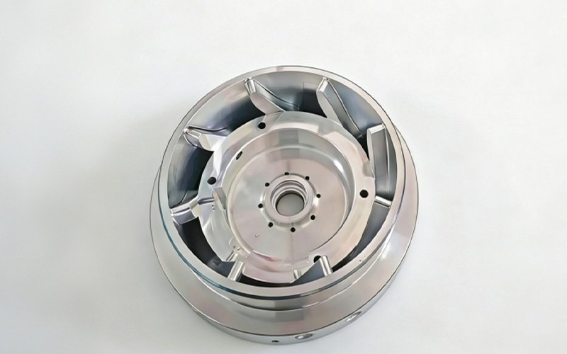 5-Axis CNC Milled Internal Vanes Top view of 5-axis CNC machined Aluminum 7075 shrouded centrifugal impeller, showcasing complex 3D swept internal vanes and high-precision Ra 0.8 surface finish.