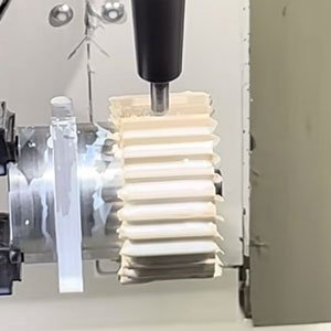 5-Axis CNC Machining of Custom PEEK Gears 5-axis CNC machining center milling a PEEK gear