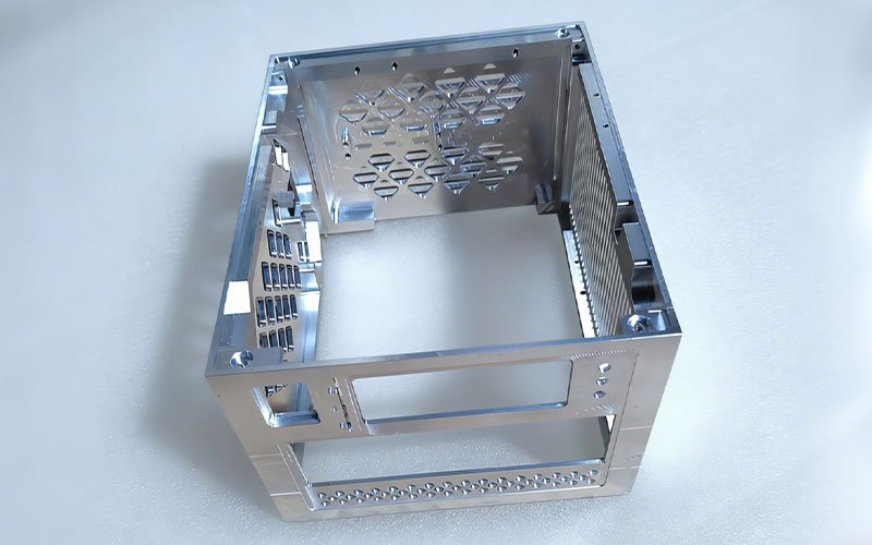 Internal view of a billet aluminum enclosure showing CNC milled diamond lattice structures and mounting standoffs.