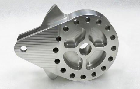 CNC machined aluminum joint drive part for automation, featuring a multi-hole flange and 3D milled surfaces.