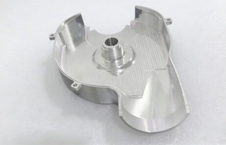 CNC machined aluminum 6061 housing cover showing deep internal pocketing, thin walls, and mounting tabs.