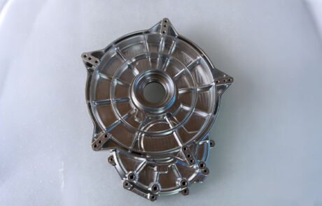 Custom aluminum 6061-T6 motor end cover machined on a 5-axis CNC center for an auto repair shop.