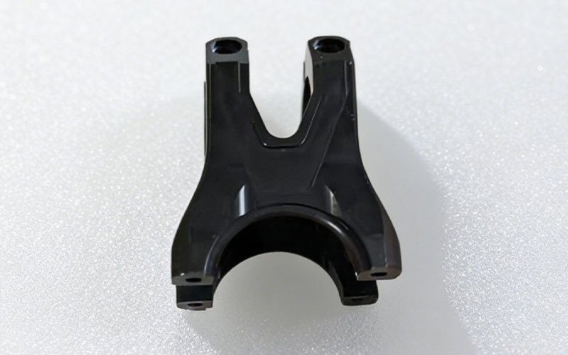 Custom Aluminum MTB Stem A precision CNC machined MTB stem accessory made from ALCOA 7075-T6 aluminum with a black anodized finish.