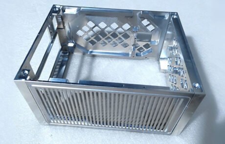 Custom CNC machined Aluminum 6061 chassis featuring deep pocket milling and long parallel ventilation slots.