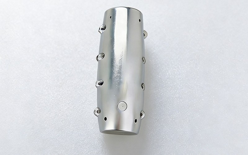 A CNC machined magnesium alloy robotic arm shell featuring mounting bosses, demonstrating ultra-lightweight structural manufacturing capabilities.