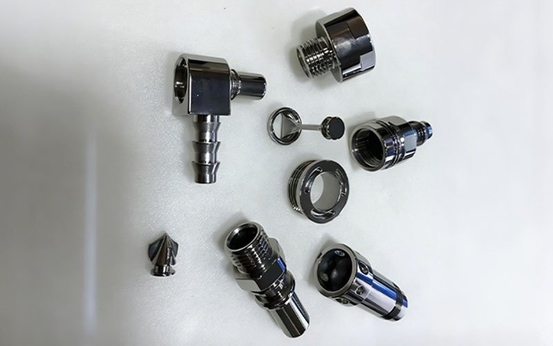 Custom liquid cooling connectors produced via turn-mill composite machining, featuring a flawless high-gloss polished stainless steel finish.