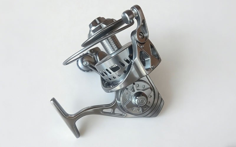 A premium spinning fishing reel CNC machined from a solid aluminum billet.