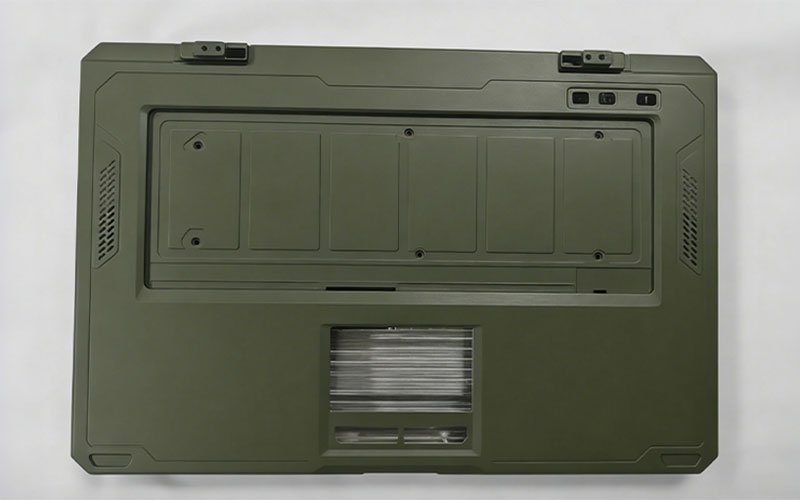 Exterior view of a custom military-grade rugged laptop enclosure with an olive drab textured coating and integrated reinforcement features.