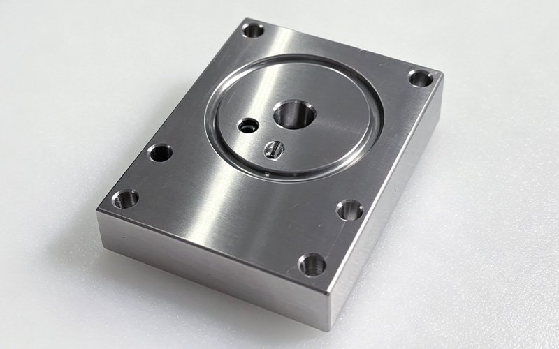 316L stainless steel CNC machining — finished precision part Finished 316L stainless steel CNC machined part with precision bores and mounting holes