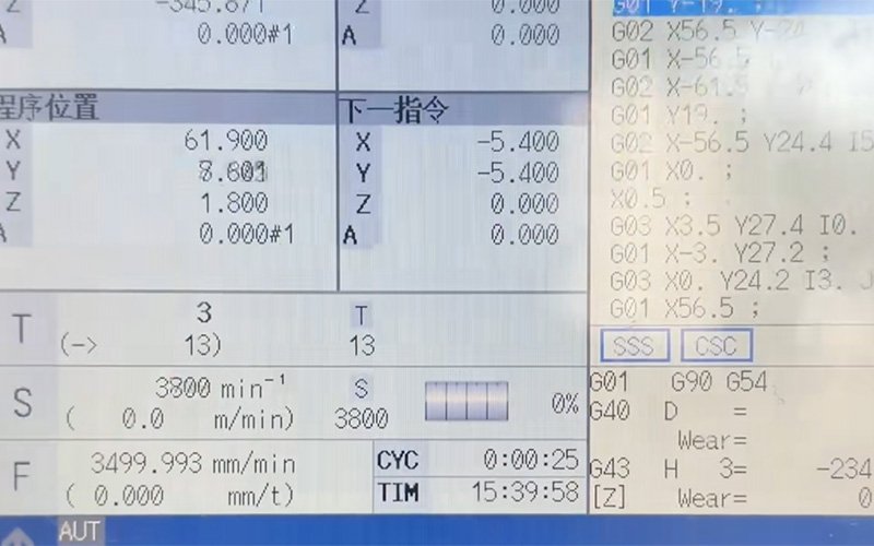 CNC control panel showing spindle speed and feed rate settings for 316L stainless steel machining