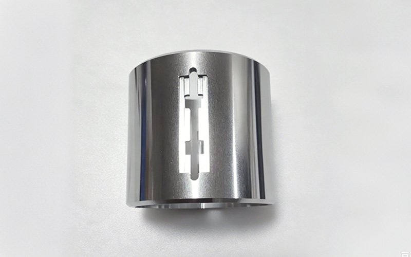 CNC Turned and Milled Aluminum Lens Tube – Side Slot Detail CNC turned and milled aluminum lens tube with mirror-finish interior and precision side slot