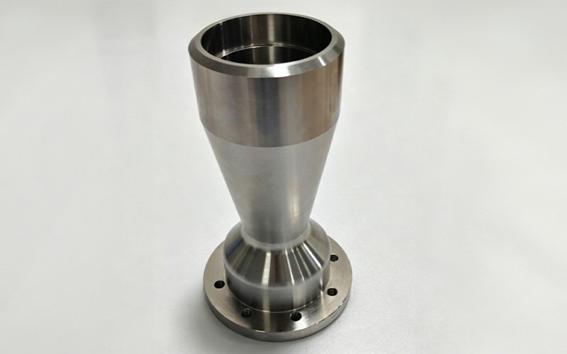 Custom Stainless Steel Flanged Conical Threaded Tube – Side View Side view of custom CNC turned stainless steel flanged conical threaded tube showing smooth tapered exterior profile and base flange