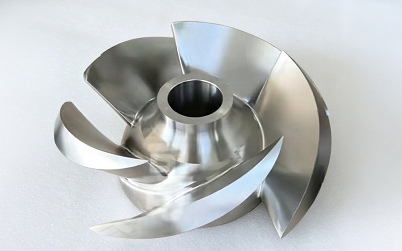 5-axis CNC machined 316L stainless steel impeller with five curved blades, mirror-polished finish
