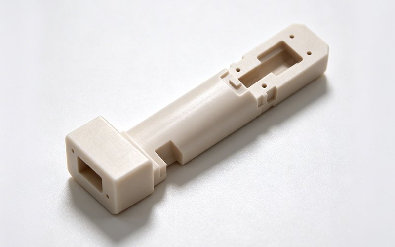 PEEK sensor housing for water quality probe, CNC machined with thin-wall window and slender shaft