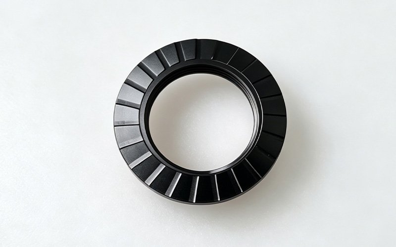 Anti-slip teeth on the face of a CNC machined aluminum lock nut