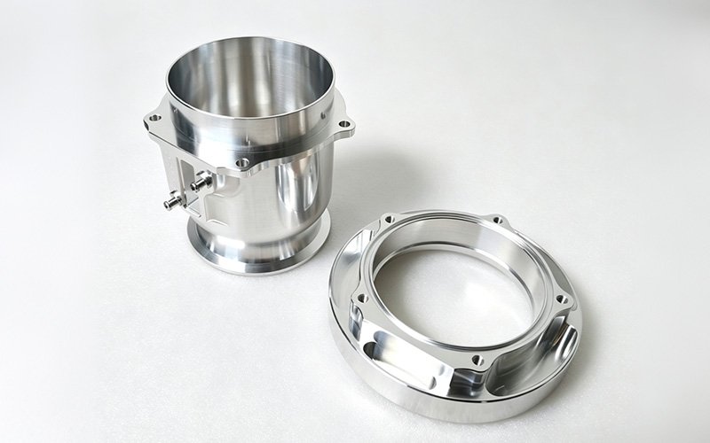 Custom CNC-machined aluminum motorcycle parts with flanges and bolt holes