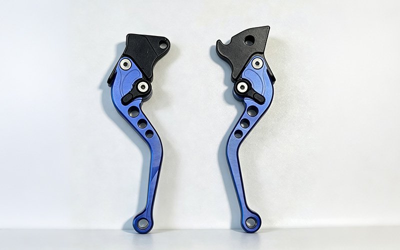 Custom CNC machined short adjustable motorcycle brake and clutch levers in blue anodized finishes