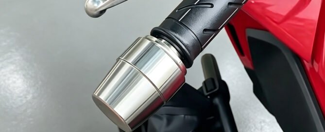Custom CNC-machined stainless steel bar end weight installed on a Honda NX500 handlebar