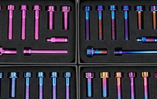 Kit of custom anodized titanium motorcycle bolts in multiple colors
