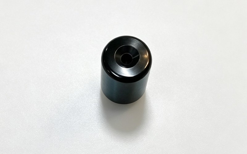 Stock black bar end weight from a Honda NX500, 172 grams