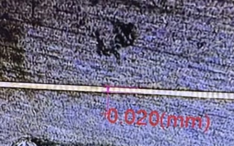 Inspection equipment measurement confirming a 0.02mm slit width on a custom spinneret plate