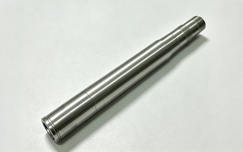 CNC-turned titanium steering stem for a custom motorcycle triple clamp