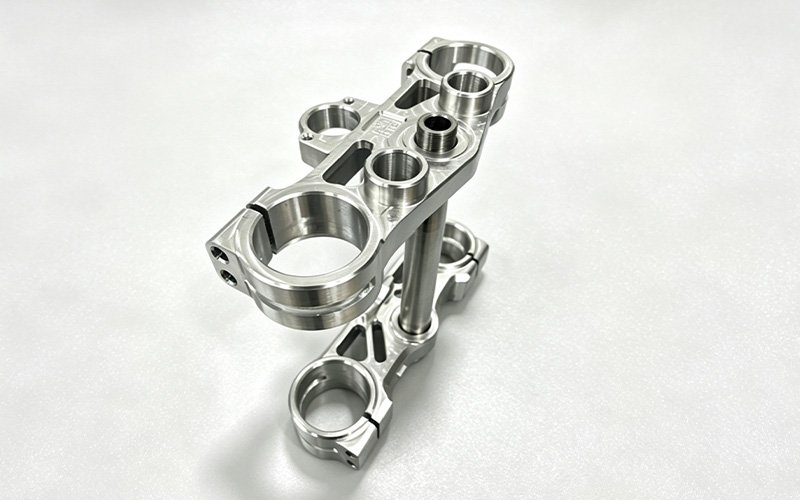 Machined custom triple clamp assembly, upper and lower 7075-T6 clamps with the titanium stem